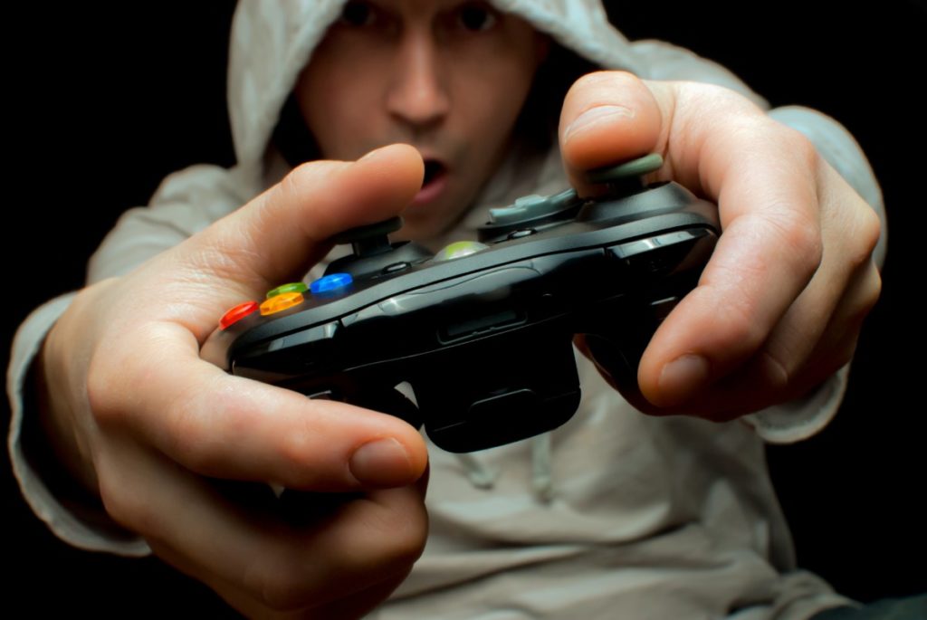 ADHD and Video Games: Young man who may have ADHD playing a video game. 